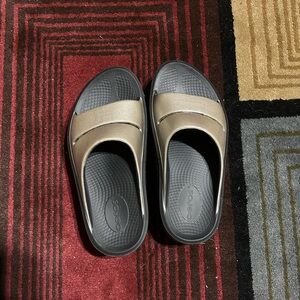 OOFOS Gold and Black Slide Sandals